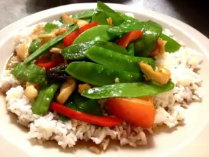 Stir-fry with snow peas, red pepper and cashews over jasmine rice at Thai House Restaurant