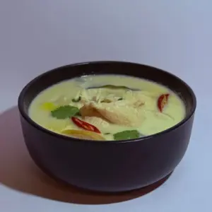 Bowl of green curry with chilies from Anchan Thai Fusion