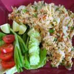 Thai fried rice with cucumber, lime, tomatoes and green beans