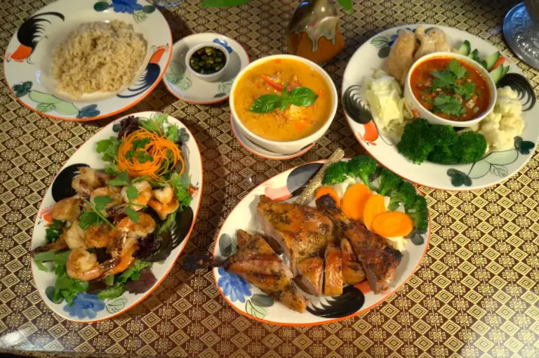 Table spread of several Thai curries and stir-fries served at Lemongrass Thai Cuisine