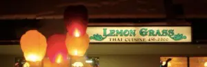 Illuminated Lemon Grass Thai Cuisine sign above the entrance, framed by glowing paper lanterns
