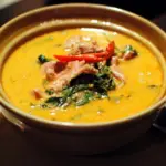 Thai red curry with pork, red chili and basil